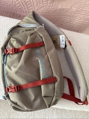Patagonia Tan Sling Bag with Red Strap Accents